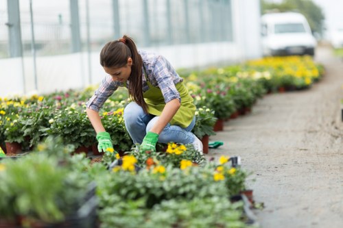 Gardener Chelsea team preparing recycling containers on a garden site